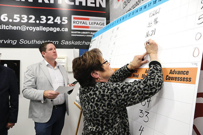 Heather Truman recording the results called in by scrutineers at each poll on election night. At left is campaign manager Murray Gray.